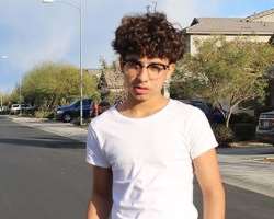 Josiah is seen with glasses in some of his posts.